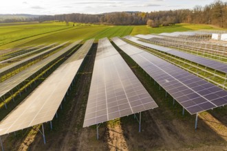 Rows of solar panels in a rural field, energy transition, construction of PV open space,