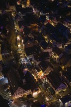 Aerial view of illuminated city at night with busy streets and festive atmosphere, Christmas