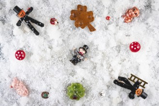 Various lucky charms and decorations on snow, New Year's Eve