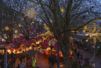 Christmas market on Holstenplatz in Kiel, city center, trees, shops, pedestrian zone, early
