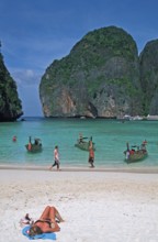 People, longtail boats on Maya Bay beach, known from the movie The Beach, one year in front of the