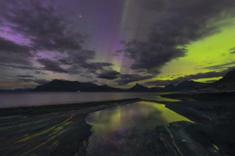 The Vestfjord in Nordland, Norway, has an enchanting atmosphere at night. Dark clouds and vivid