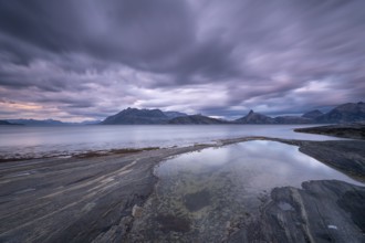 The Vestfjord in Nordland, Norway, offers a dramatic atmosphere near Bodø. Dark clouds are