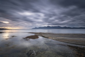 The Vestfjord in Nordland, Norway, near Bodø, impresses with a dramatic atmosphere. Dark clouds