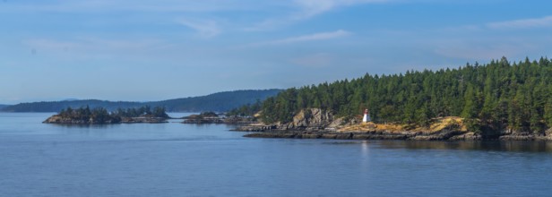 Passengers traveling by ferry from vancouver to victoria, british columbia, enjoying scenic views
