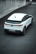 Rear view of a white modern SUV on a paved road, Deer e-car sharing, Renault Megane, Calw, Germany