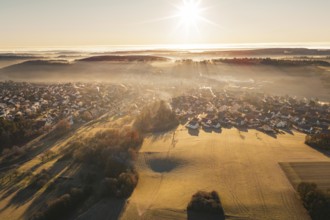 Fog-covered settlement at sunrise with open landscape view, Gechingen, Calw district, Germany