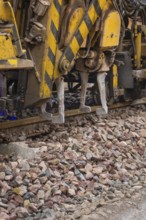 Close up of a construction machine used for track work on gravel, tamping machine on Hermann,