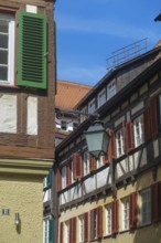 Typical old town scene, half-timbered houses, old street lamp, light, shutters, idyll, Tübingen,