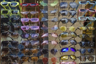 Colorful sunglasses, range of products, eyeglass holder, eyeglass stand, funny shapes, Tübingen,