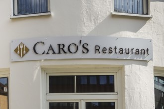 Caros restaurant, tavern, restaurant, sign, lettering, symbol forks, white house façade, Tübingen,