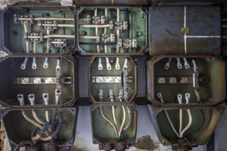 Old power box, dilapidated plant of a former agricultural production cooperative of the former GDR,