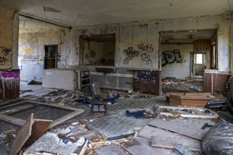 Abandoned room with old furniture and gravity in a building, dilapidated site of a former