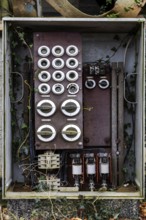 Old power box, dilapidated plant of a former agricultural production cooperative of the former GDR,