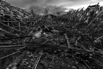 Dilapidated hall of the dilapidated plant of a former agricultural production cooperative of the