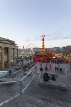 Stuttgart 2025 Christmas market on Schlossplatz with festive lights, a Christmas pyramid, mulled