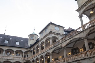 At Christmas time, the Old Palace in Stuttgart shines with festive poinsettias in the courtyard.