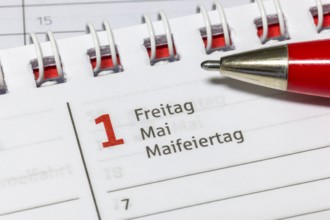 Calendar detail shows May 1, a Friday, highlighted as May Day, agenda