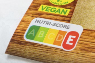 Food packaging with prominent Nutri-Score label and vegan sticker