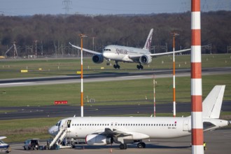 Düsseldorf airport, Qatar Airways Boeing 787 Dreamliner landing, Eurowings aircraft on the apron,