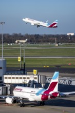 Eurowings aircraft, at terminal A and at takeoff, Düsseldorf airport, DUS