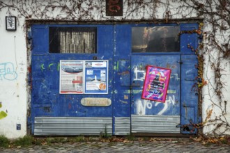 Old entrance gate covered with posters, Hanseatic City of Stralsund, Baltic Sea,