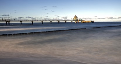 Groes and pier with diving gondola, panorama, long exposure, evening light, Zingst,