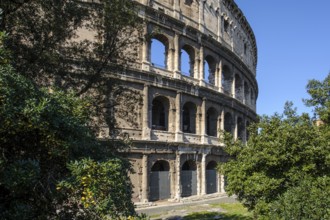 View of the partially restored façade outer façade of the Roman Colosseum from ancient times, west