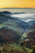 View from Belchen heading south of Wiesental and the Swiss Alps, morning atmosphere with fog in