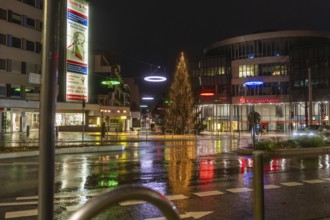 Illuminated Christmas tree and colorful street lights in the city at night, Böblingen Christmas