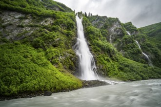 Horsetail Falls waterfall on the Lowe River in a green gorge, long exposure, Keystone Canyon,