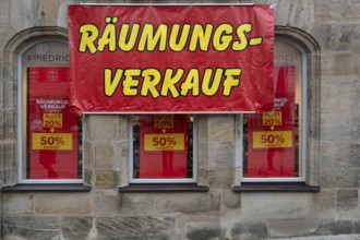 Posters for clearance sale at a shoe store, Lauf an der Pegnitz, Middle Franconia, Bavaria, Germany