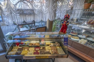 Showcases with homemade chocolates and cakes on the display case the trademark of the Sarotti