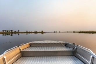 Sunset boat trip on a lake, boat safari, Xakanaxa Lagoon, Okavango Delta, Moremi Game Reserve,