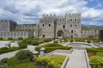 Historical complex with massive stone fortress, well-kept garden and round fountain, Rabati