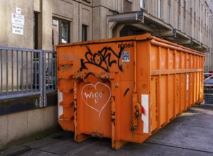 Orange-colored building container, Berlin, Germany