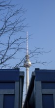 View between two construction containers towards the TV tower at Alexanderplatz, Berlin, Germany