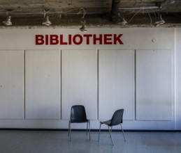 Empty chairs stand in front of access to a library, Berlin, Germany, which has been closed due to