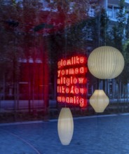 Ceiling lights, looking through the shop window into the interior of a furniture store, Berlin,