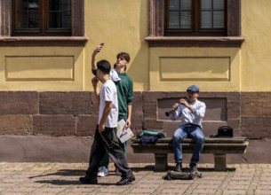 Young tourists in the old town of Fulda, Hesse, Germany
