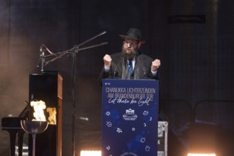 Yehuda Teichtal (Rabbi of the Chabad-Lubavitch movement) speaks at the lighting of lights to mark