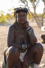 Portrait, brightly decorated woman of the Hakaona tribe, also Havakona or Hakawona, near Opuwo,