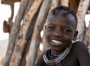 Portrait, cheerful Himba child, traditional Himba village, Kaokoveld, Kunene, Namibia