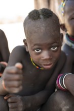 Portrait, curious Himba child, traditional Himba village, Kaokoveld, Kunene, Namibia
