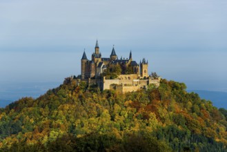 Castle and autumnal forest, Hohenzollern Castle, sunrise, Hechingen, Swabian Jura,