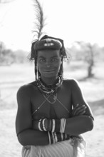 Black and white, portrait, brightly decorated woman of the Hakaona tribe, also Havakona or