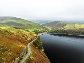 Autumn colours over Llyn Clywedog and Clywedog Reservoir from a drone, Llanidloes, Wales, UK