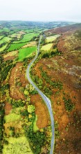 Autumn colours of Farms over River Wye and Road A470 from a drone, Llanidloes, Powys,