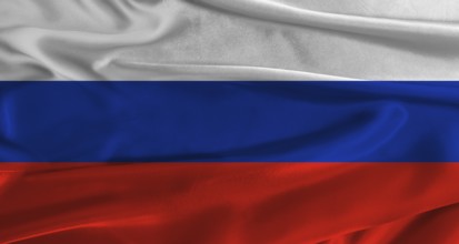 Flag of Russia with fabric textured background. Close up of National flag of Russia with realistic