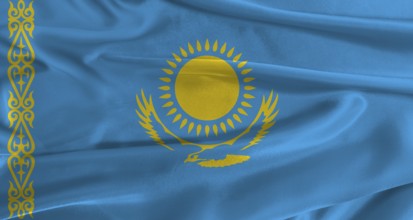 Flag of Kazakhstan with fabric textured background. Close up of National flag of Kazakhstan with